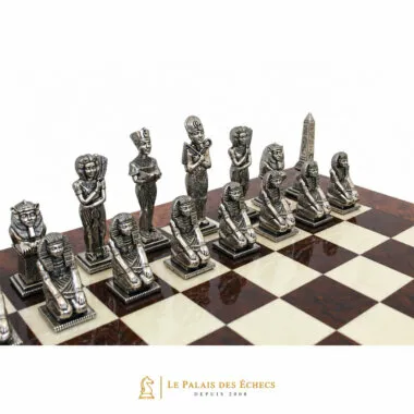 Egypt chess pieces in silver-toned metal viewed from the front on the board
