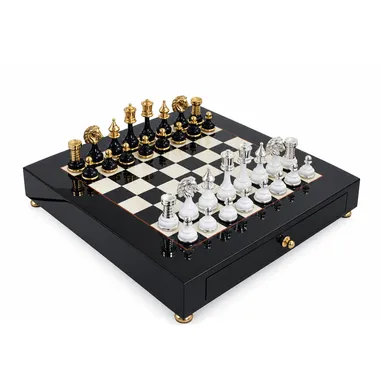 Black and white pedestal chess board with gold and silver pieces, box closed