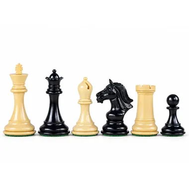 Boxwood and ebony chess pieces, dark queen and knight beside light bishop