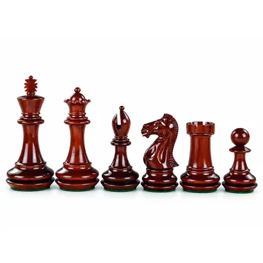 Red pieces in padauk wood, close-up of queen, bishop, knight and rook