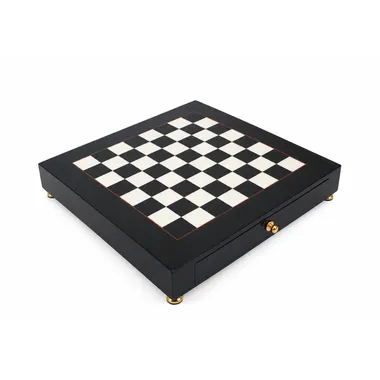 Black and white wooden chess board, overall view on gilt feet