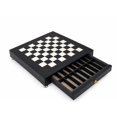 Black and white wooden chess board, open drawer with storage compartments