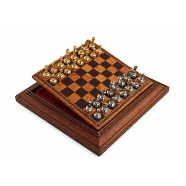 Magnetic chess set placed open on its wooden storage box