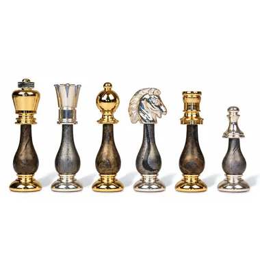 Chess pieces in gold and silver-plated brass, detail of king, rook, knight