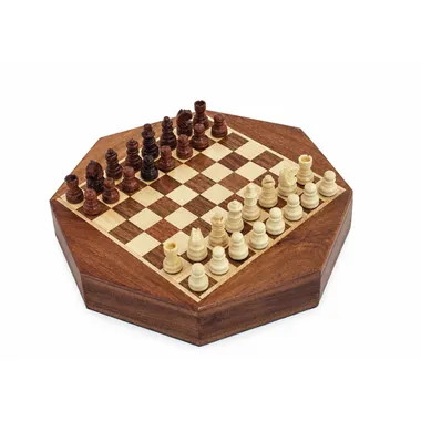 Octagonal acacia wood chess board with pieces set up for play