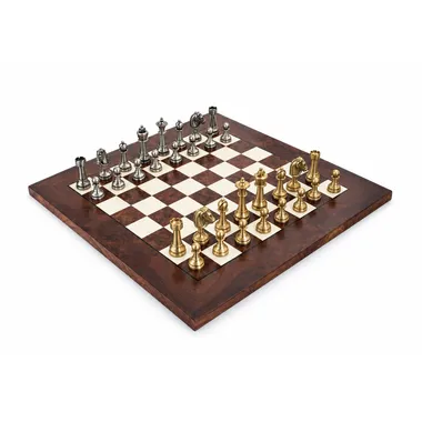 Complete chess set in brass on a glossy walnut wood chessboard