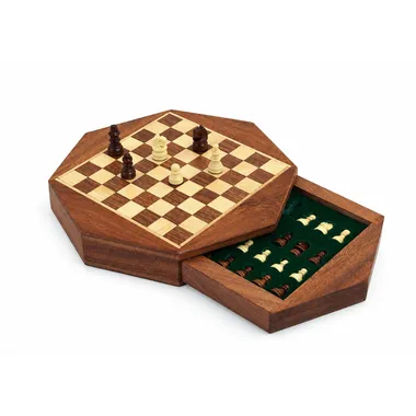 Open octagonal chess set showing the drawer lined with green felt