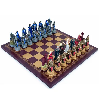 King Arthur resin chess set arranged on the burgundy and gold faux leather board