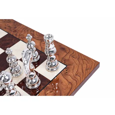 Close-up of silver-plated brass pieces at the corner of the briar wood board