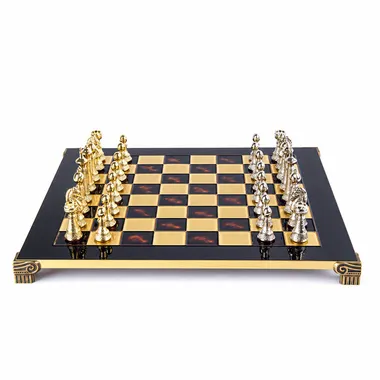 Staunton metal chess board, gold and silver pieces facing off