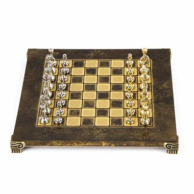 Footed chess board viewed from above with aligned silver and gold pieces