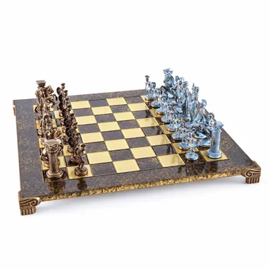 Metal chess board with bronze and blue pieces facing off, angled overview