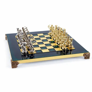 Green and gold metal chess board with silver and gold archer pieces facing off