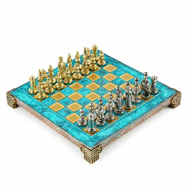 Turquoise chess board with carved feet, gold and silver Byzantine pieces facing off