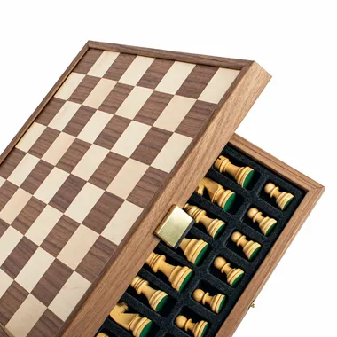 Open storage box showing the folded chess board and pieces in their compartments