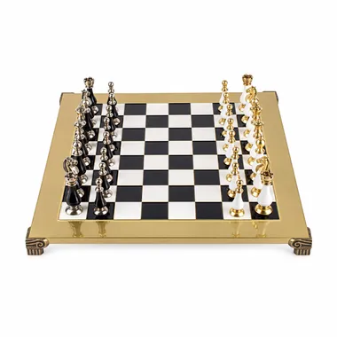Staunton chess set in black and white, overall view on golden board