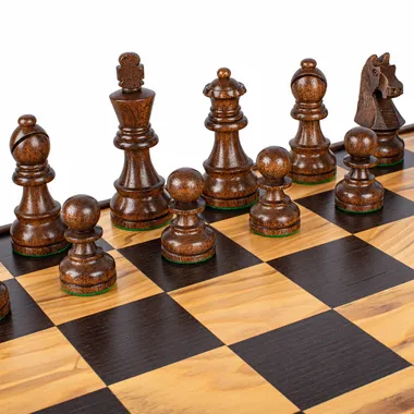 Dark wooden chess pieces on the olive burl chess board