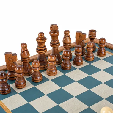 Close-up of dark wooden chess pieces on the turquoise chess board