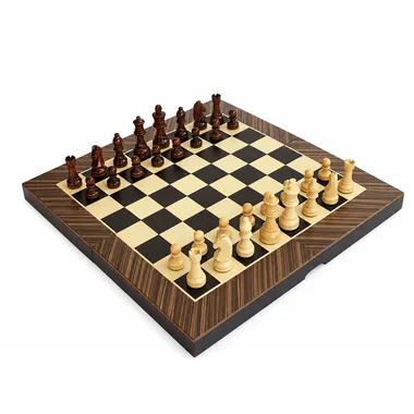 Open wooden chess board with wooden pieces set up for a game