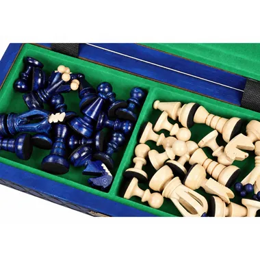 Blue and ivory chess pieces stored in the box lined with green felt
