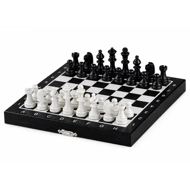 Mini wooden chess set in black and white, open board with pieces set up