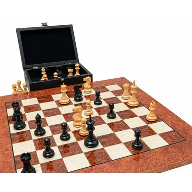 Open storage box with black and natural chess pieces on the board