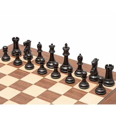 Black Warwick pieces in ebonised boxwood viewed from behind on the chessboard