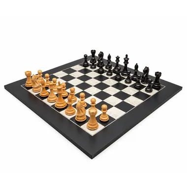 Complete black and white chess set, pieces in starting position on the board
