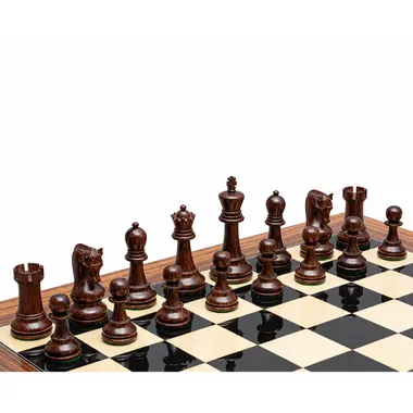 Dark Anjan wood chess pieces lined up on the rosewood chess board