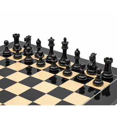 Black pieces of the luxury Staunton chess set lined up on the board