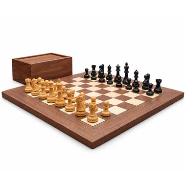 Levisham black and walnut chess set on a wooden table in a warm atmosphere