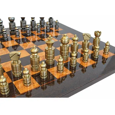 Contemporary solid brass golden chess pieces lined up on the chess board