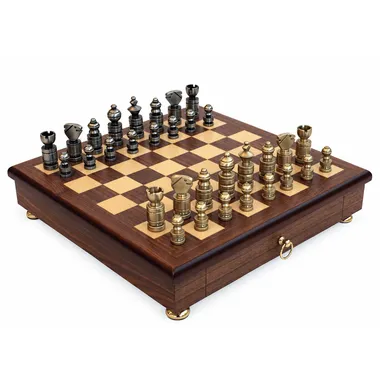 Overview of the modern chess set with solid brass pieces on a mahogany chess board with drawer