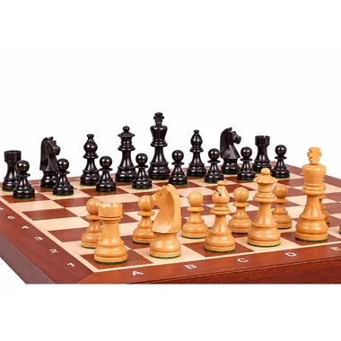 Wooden chess set with a striking angle showing the black pieces and strategic layout